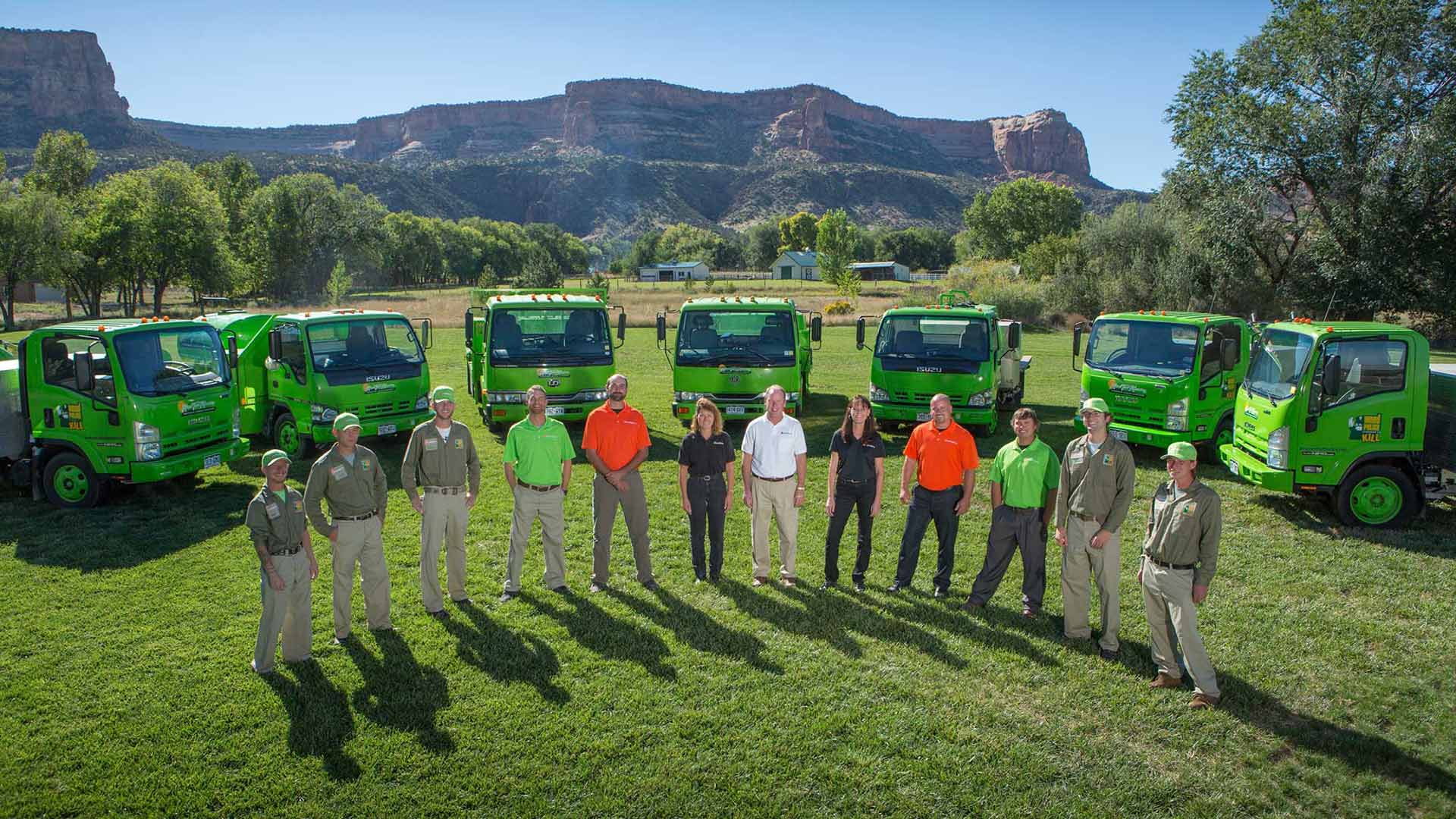The Mesa Turf Masters team and company trucks.
