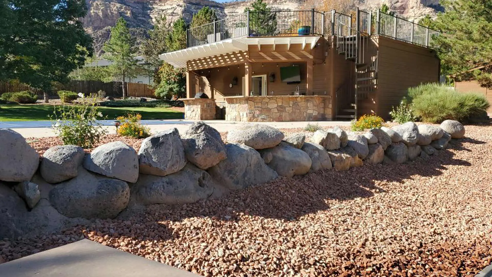 Rocks installed for landscape in Loma, CO.