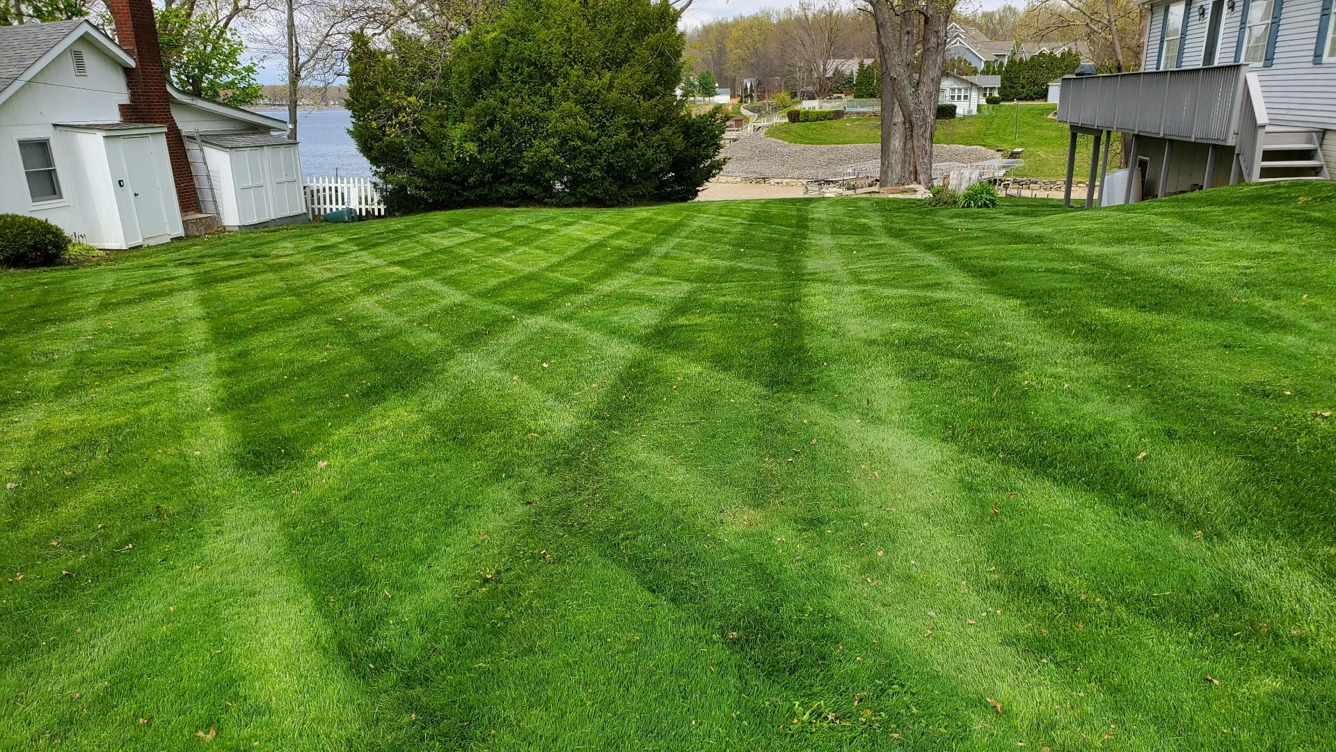 Beautifully striped green lawn with landscaping elements in Grand Junction, CO.