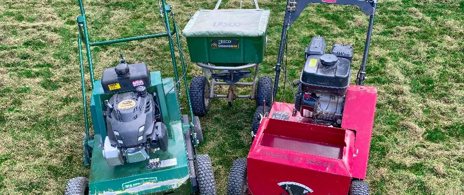 Aerator, spreader, and slit seeder machinery on a lawn in Grand Junction, CO.