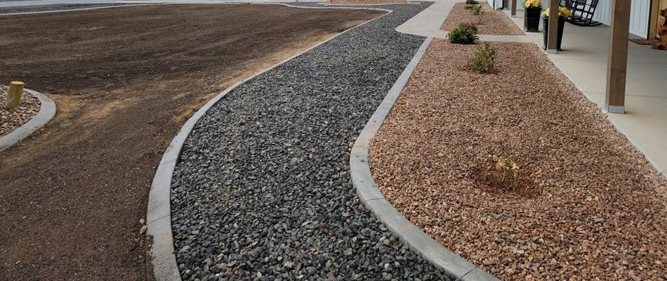 Rocks installed for walkway and landscape bed in Loma, CO.