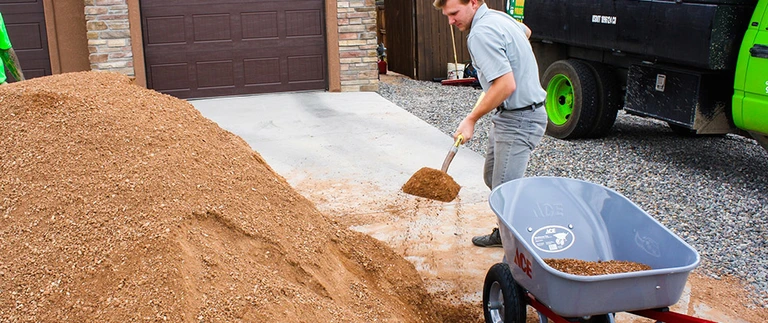 Professional installing rocks and gravel