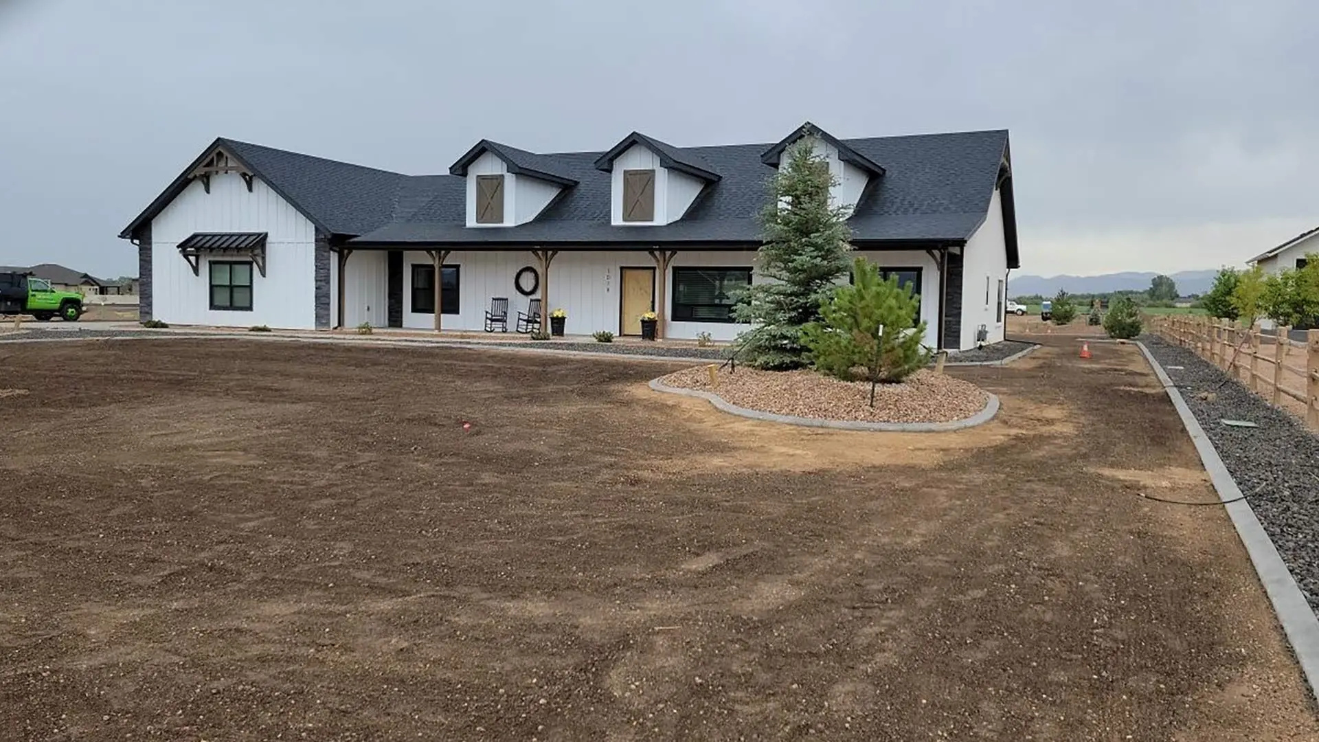Fresh mulch in a landscape bed in Grand Junction, CO, with plants.